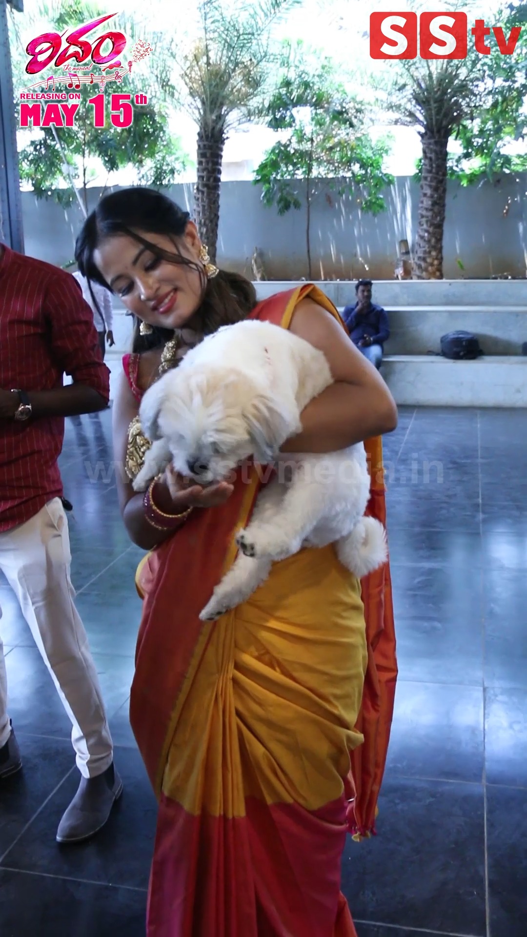 Anusha Rai playing with her dog